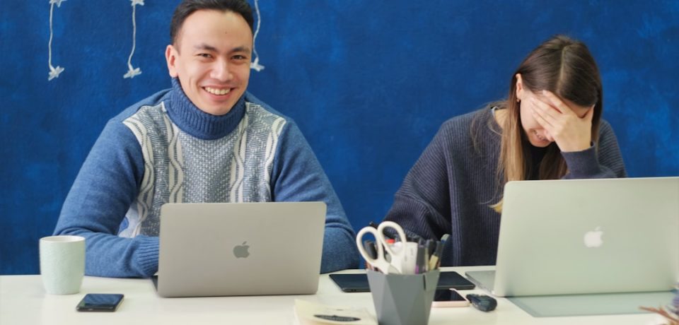 Modern workplace showing seamless collaboration between employees and AI systems in a secure digital environment